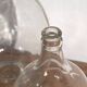 Antique glass demijohns (c.1920). Set of 2 pieces