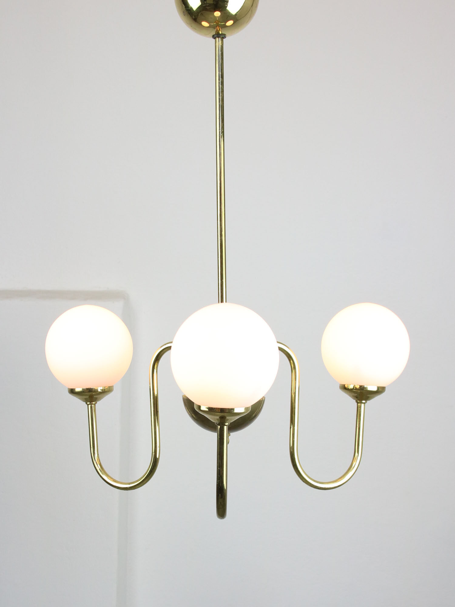 Vintage golden chandelier in opaline glass