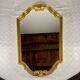 Hexagonal mirror in gilded wood