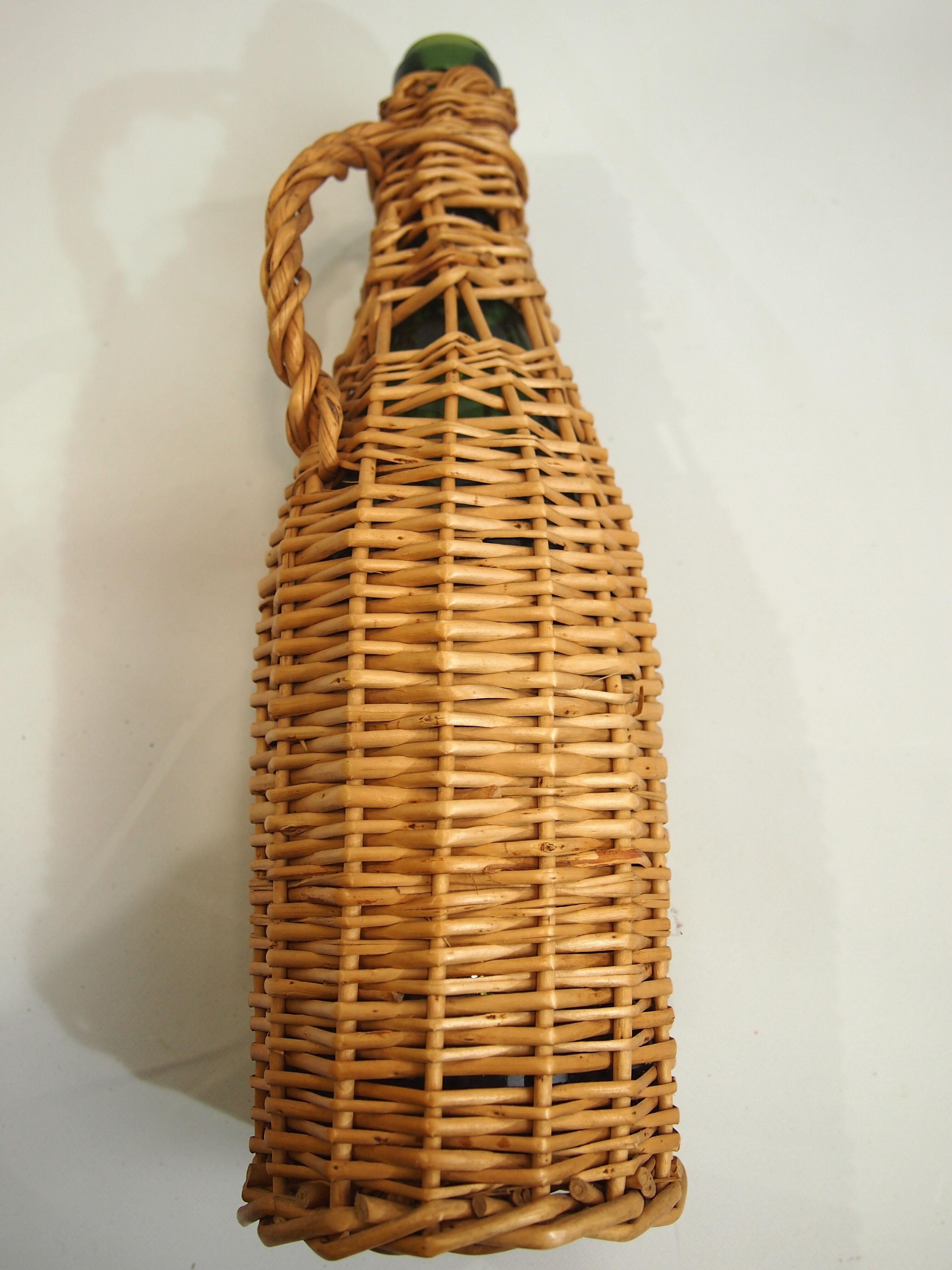 Bottle dressed in rattan