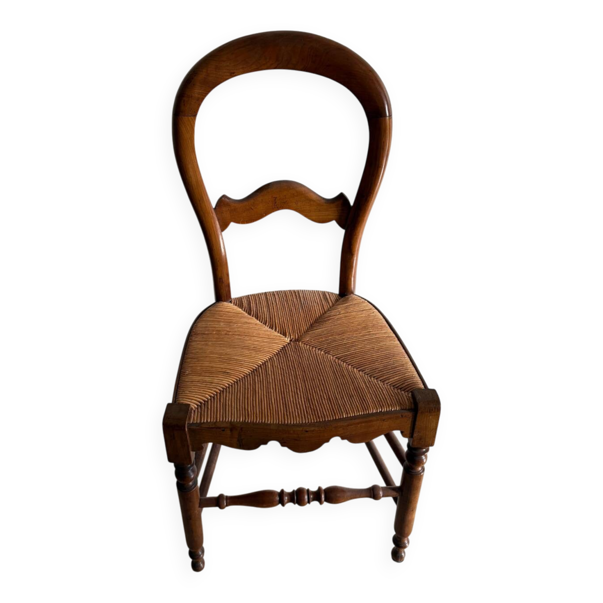 Antique wooden chair with woven straw seat – rustic style