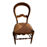 Antique wooden chair with woven straw seat – rustic style