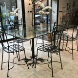 Wrought iron table with tree sculpture and glass top