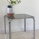 Table basse annees 70 verre et acier chromé