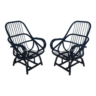 2 black rattan armchairs