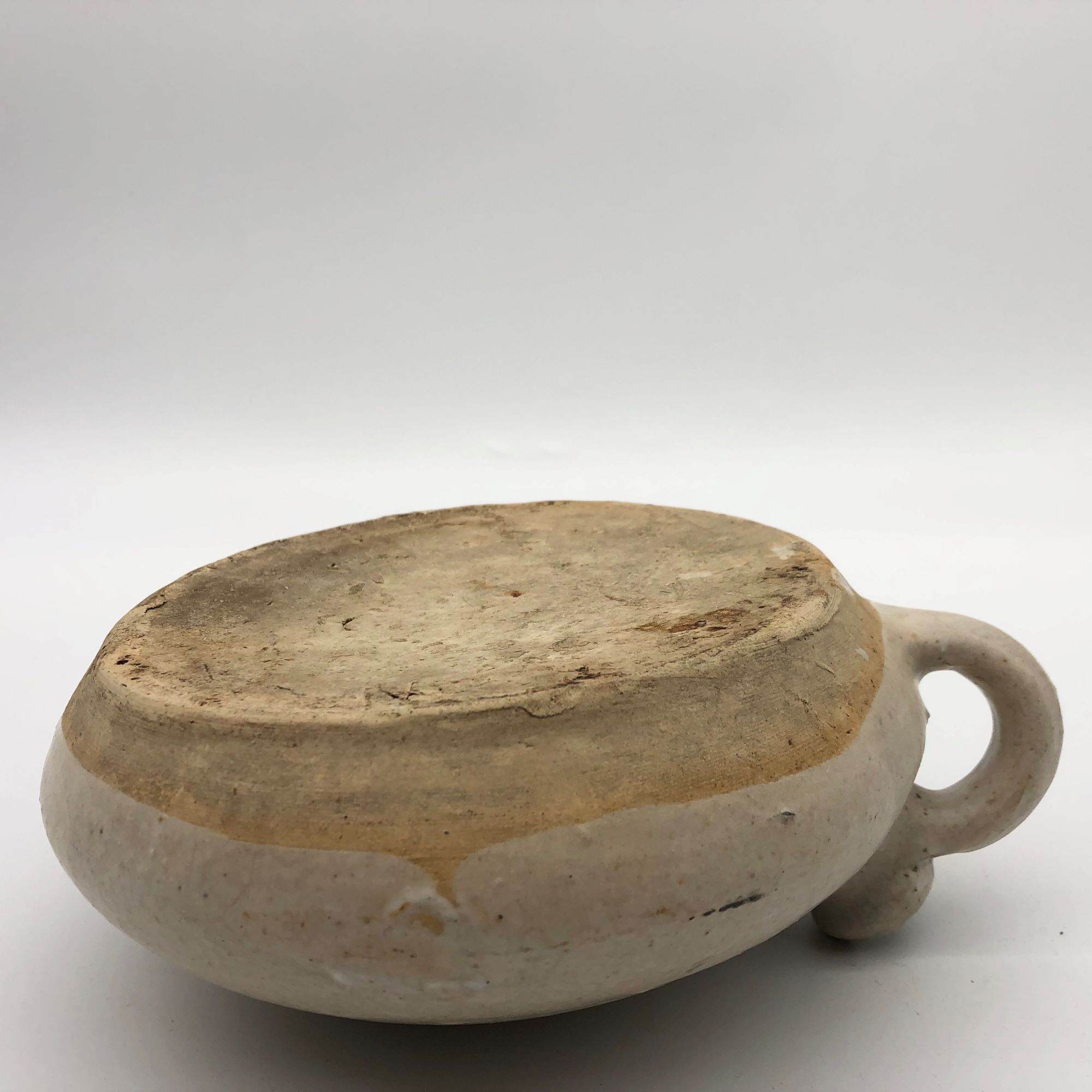 Old round sandstone hot water bottle