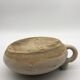 Old round sandstone hot water bottle