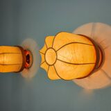 Pair of "cocoon" wall lights, resin and pine, Italy, 1970