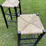 Set of 2 black wooden bar stools with rush seat from the 70s and 80s