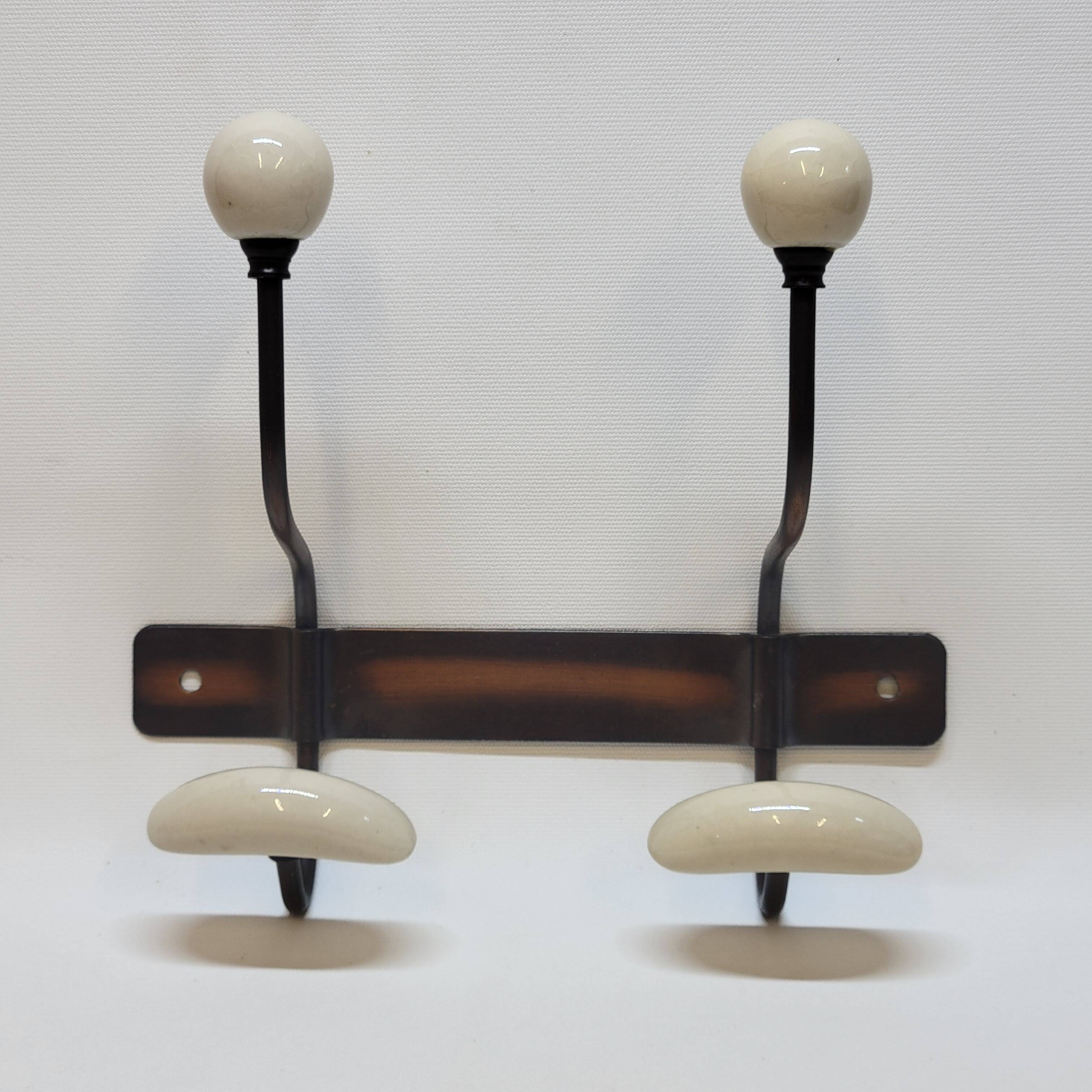 Wall coat rack in metal and porcelain with 2 hooks