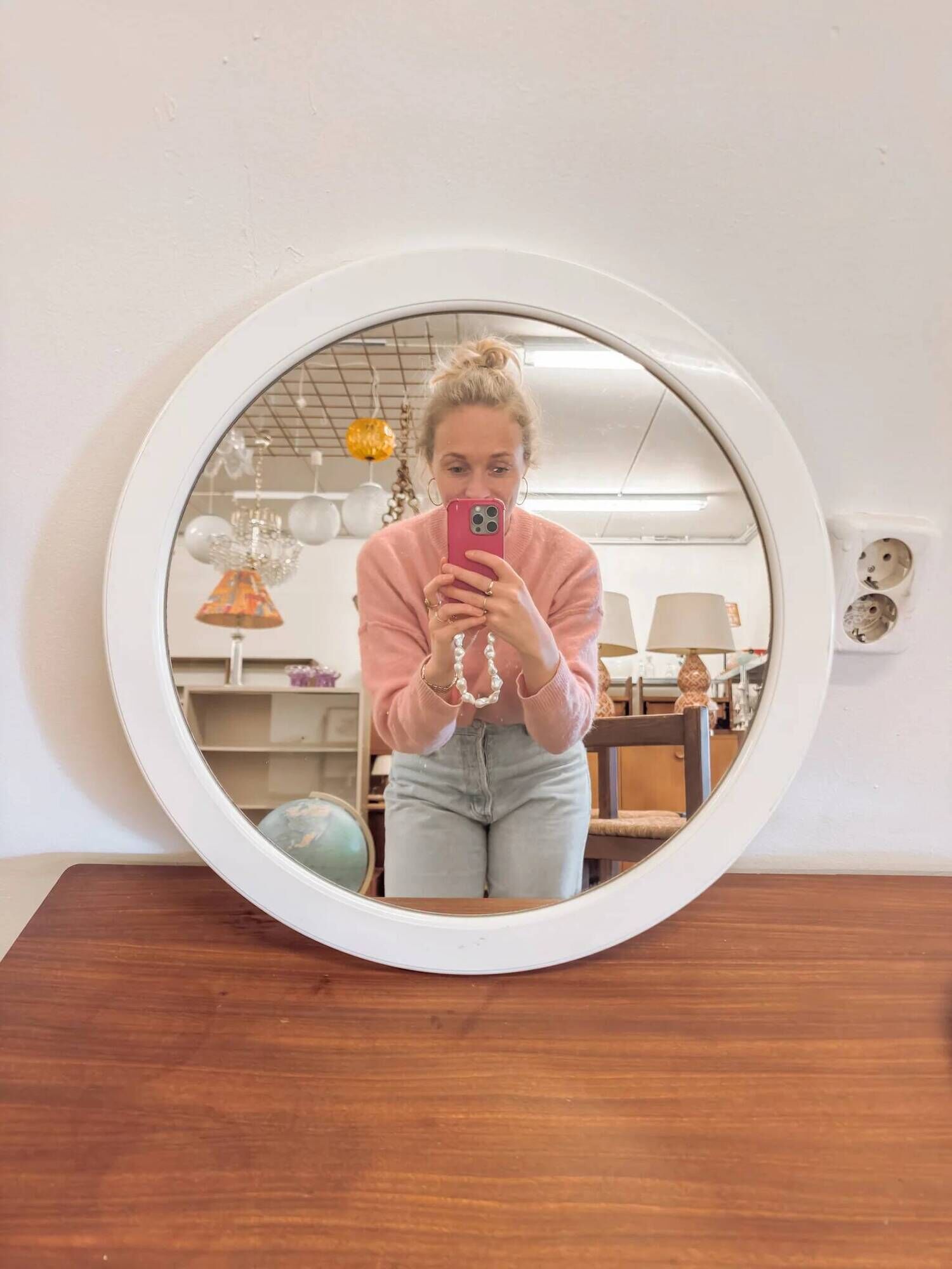 Large vintage round mirror with a white border.