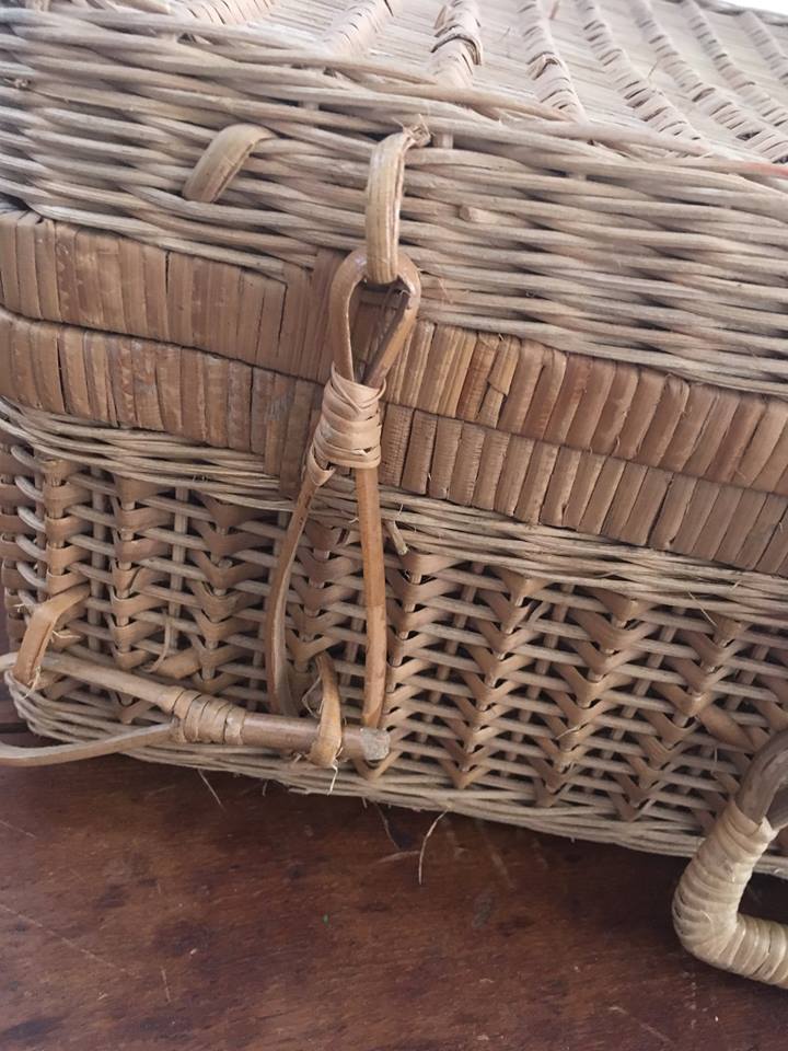 Wicker suitcase.