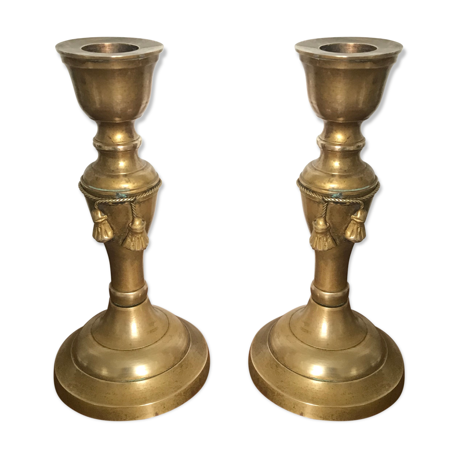 Pair of brass candlesticks with tassels