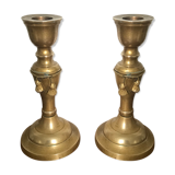 Pair of brass candlesticks with tassels