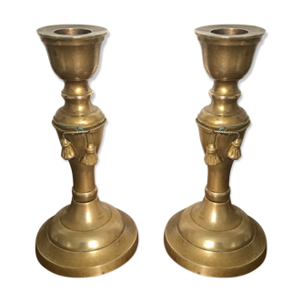 Pair of brass candlesticks with tassels
