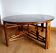 Large telescopic rattan table circa 1970