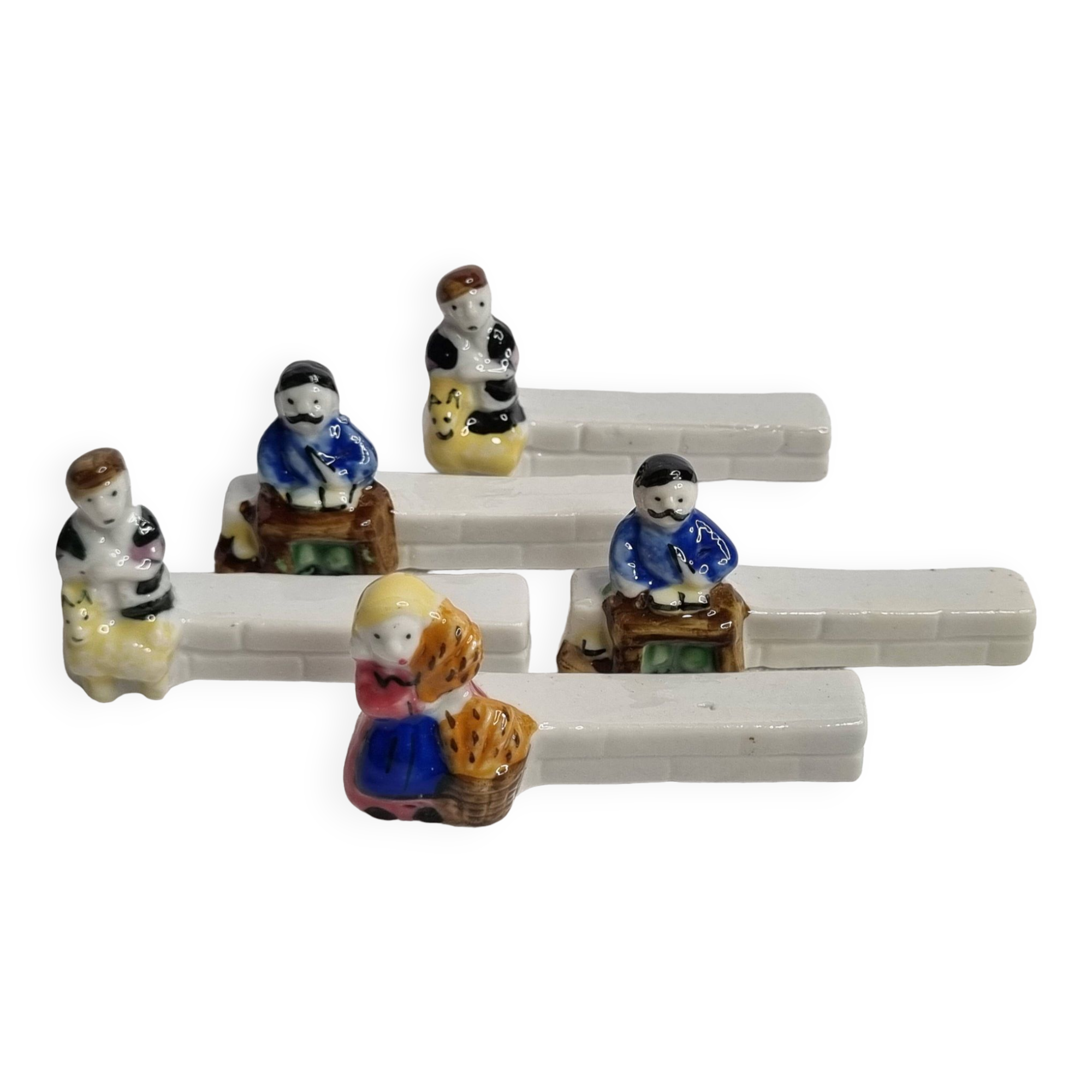 Five porcelain knife holders signed "Le Merzer", 6 cm