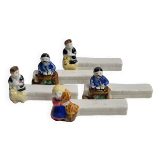 Five porcelain knife holders signed "Le Merzer", 6 cm