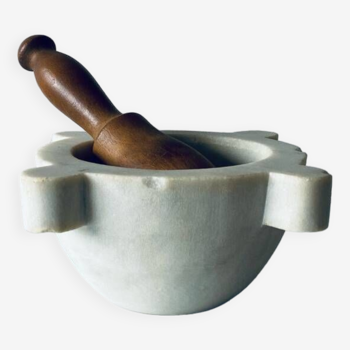 Old marble mortar with wooden pestle