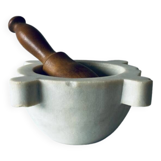 Old marble mortar with wooden pestle