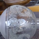 Old engraved globe oil lamp