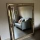 Miroir rectangulaire en bois doré sculpté