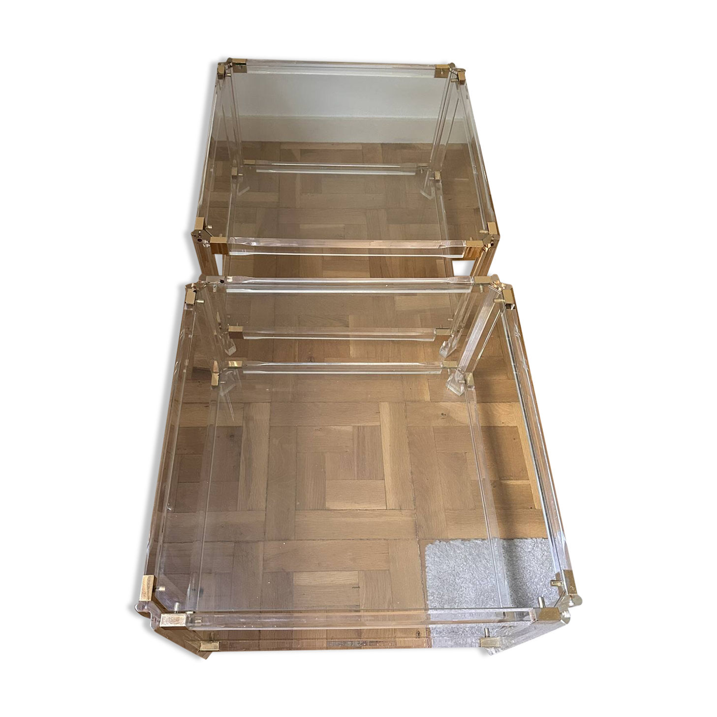 2 side tables in plexiglass, glass, and brass.