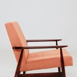 Mid-century modern armchair in coral red designed by H. Lis.