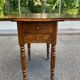 Victorian Pembroke table from the 19th century in walnut burr with drop-leaves.