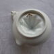 Presse-citron ancien en porcelaine de Limoges blanc et doré