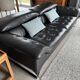 Two-seater black leather sofa Roche Bobois