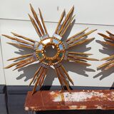2 wooden sun mirrors and golden plaster