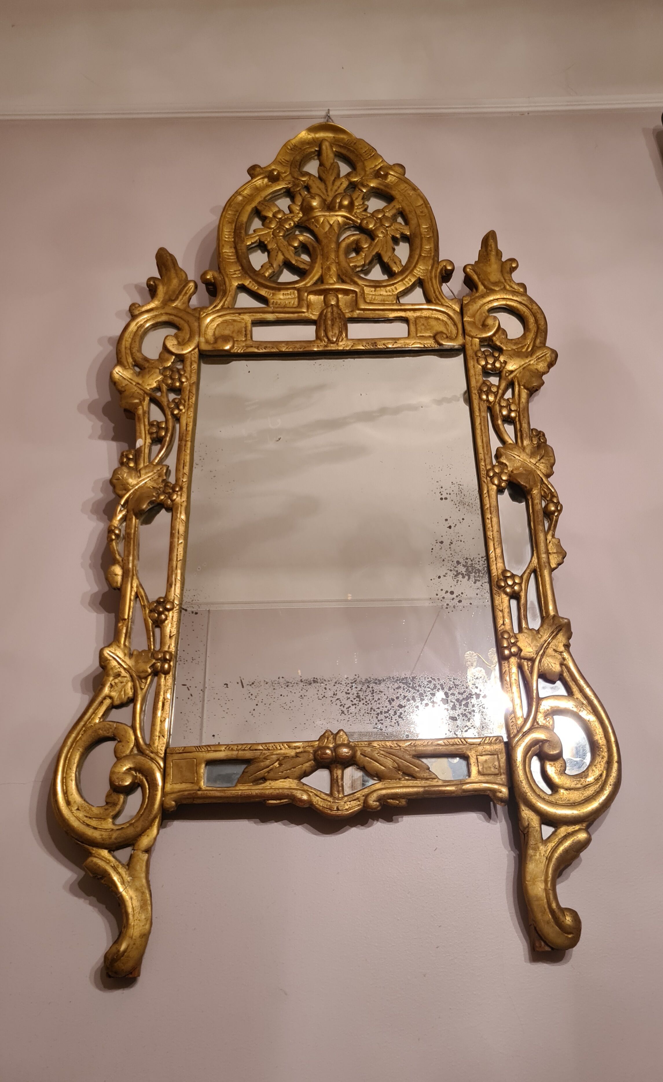 Gilded wooden mirror with parecloses, Louis XV period, circa 1750, 58x120cm