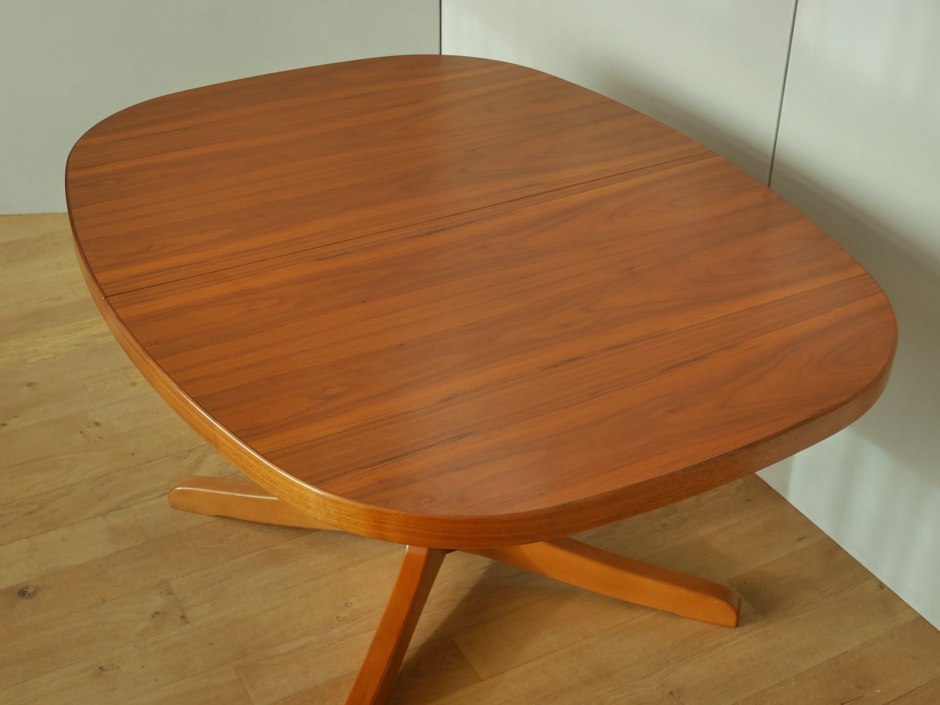 Oval walnut table with extension cords