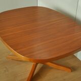 Oval walnut table with extension cords