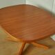 Oval walnut table with extension cords