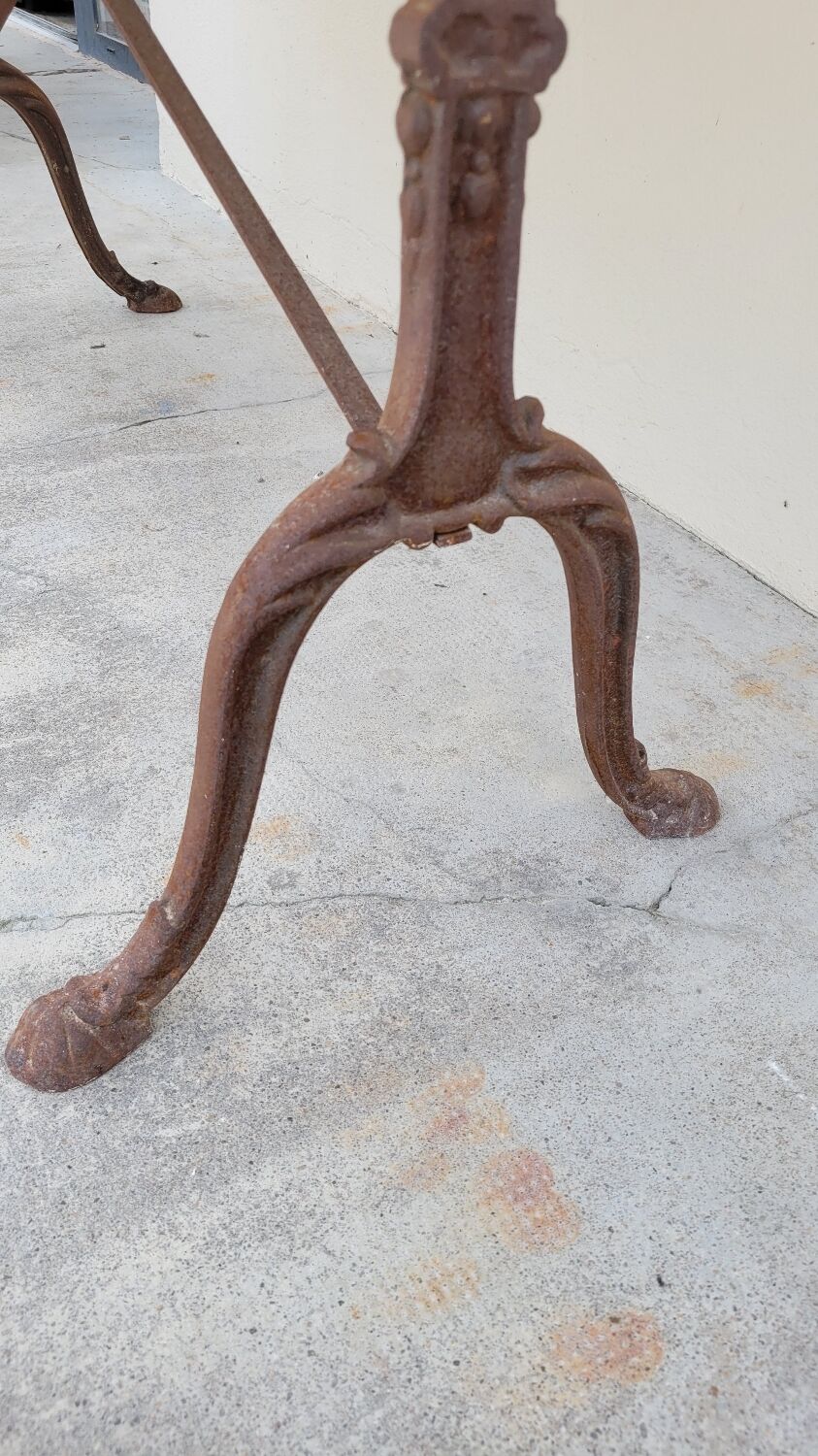 Restaurant bistro table in oval marble and decorated cast iron bases -1m51