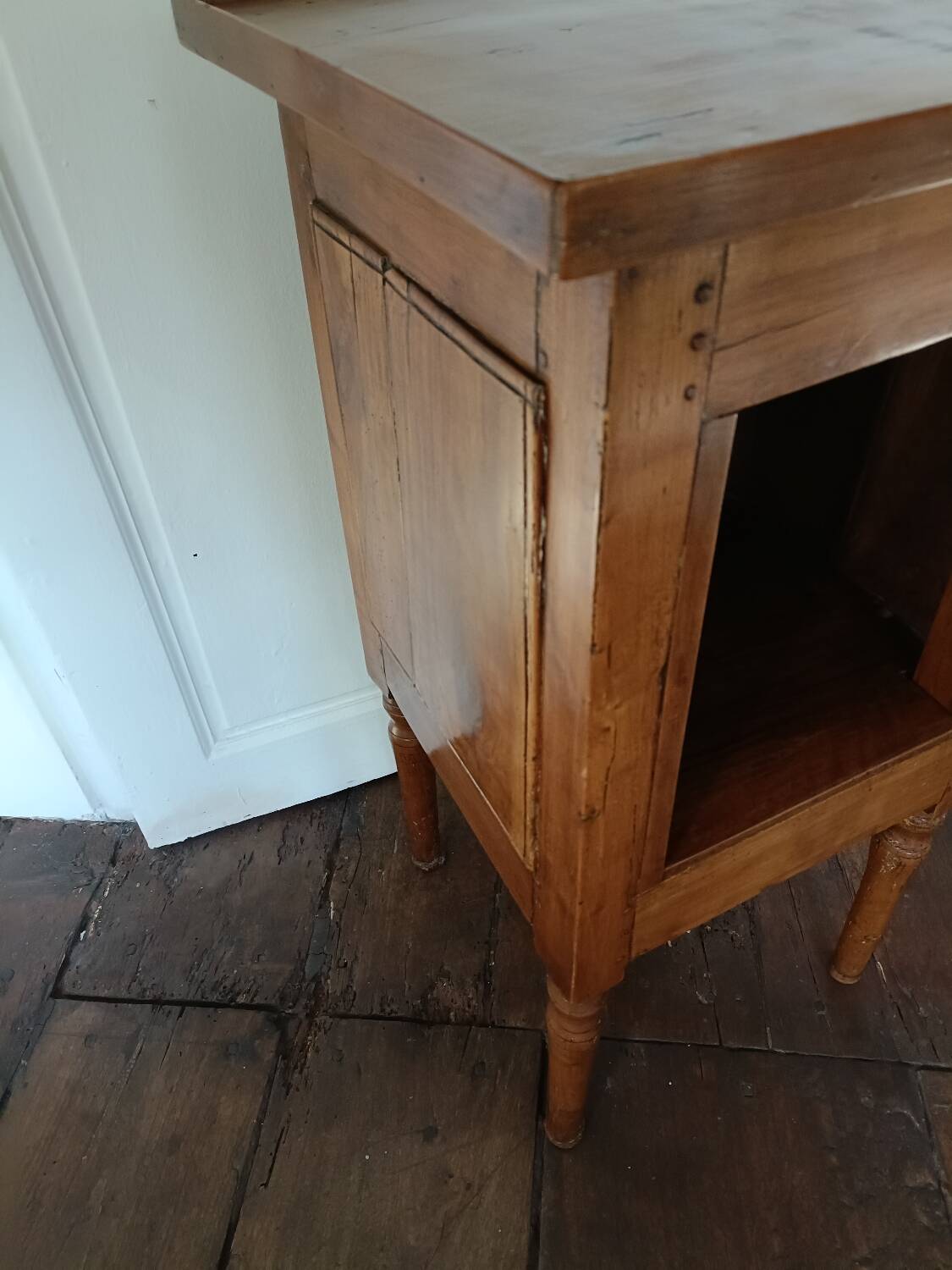 Open wooden bedside table