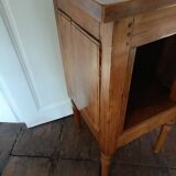 Open wooden bedside table