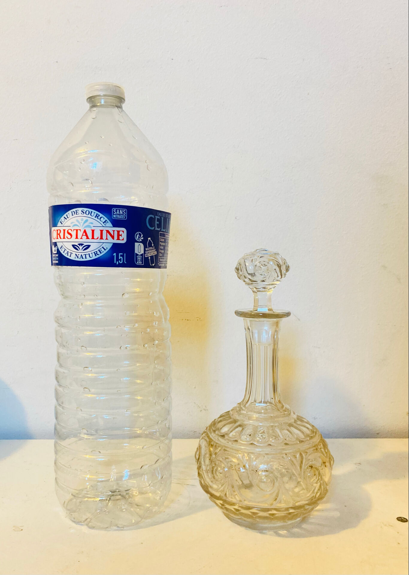 19th-century liqueur carafe in glass adorned with relief patterns.