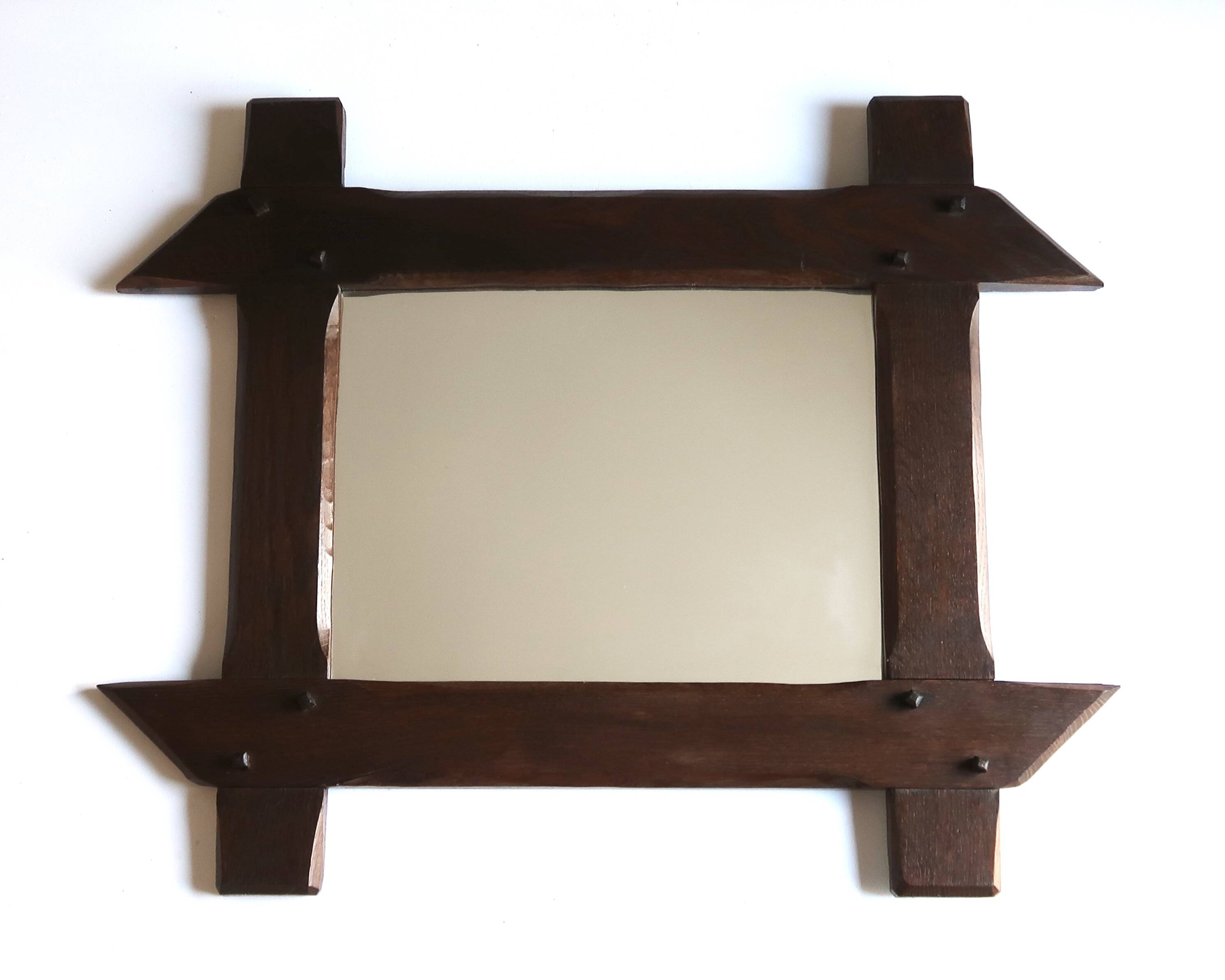 Rectangular mirror with bevelled wooden frame, 1970s.