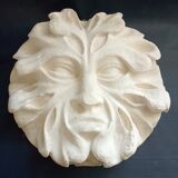 Bas relief sun in plaster
