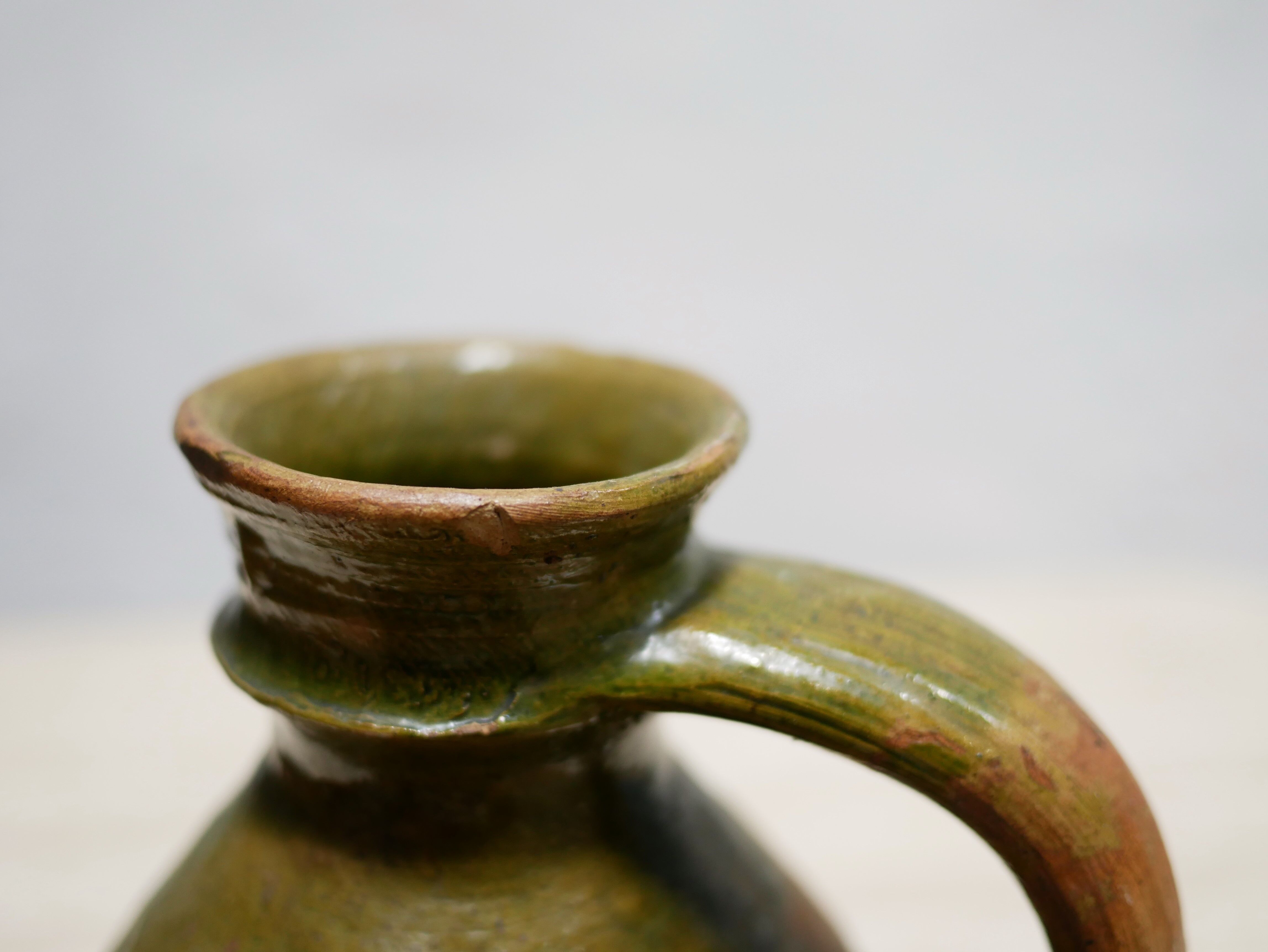 Old glazed terracotta jar