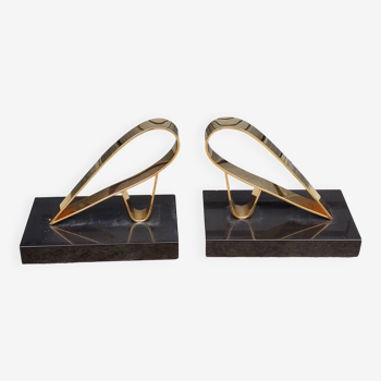 Pair of designer bookends from the 60s in gold metal and gold starry hallmark marble