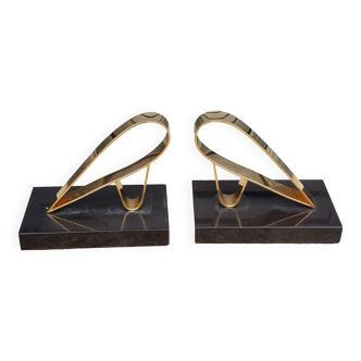 Pair of designer bookends from the 60s in gold metal and gold starry hallmark marble