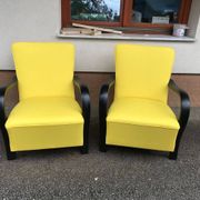 Pair of yellow Art Deco armchairs in cotton and wood, black frame, 1920s.