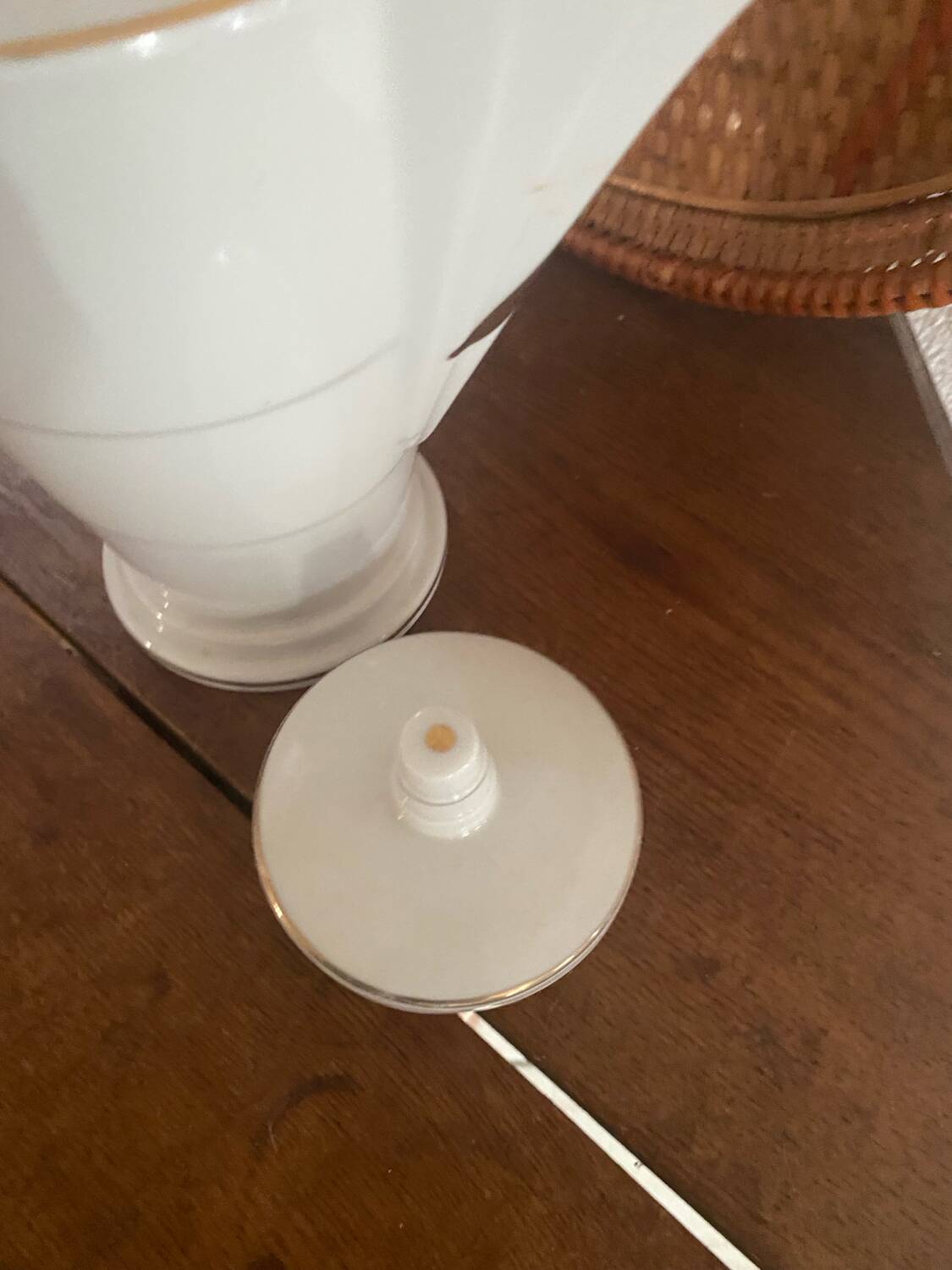 White and gold porcelain coffee pot in art deco style.