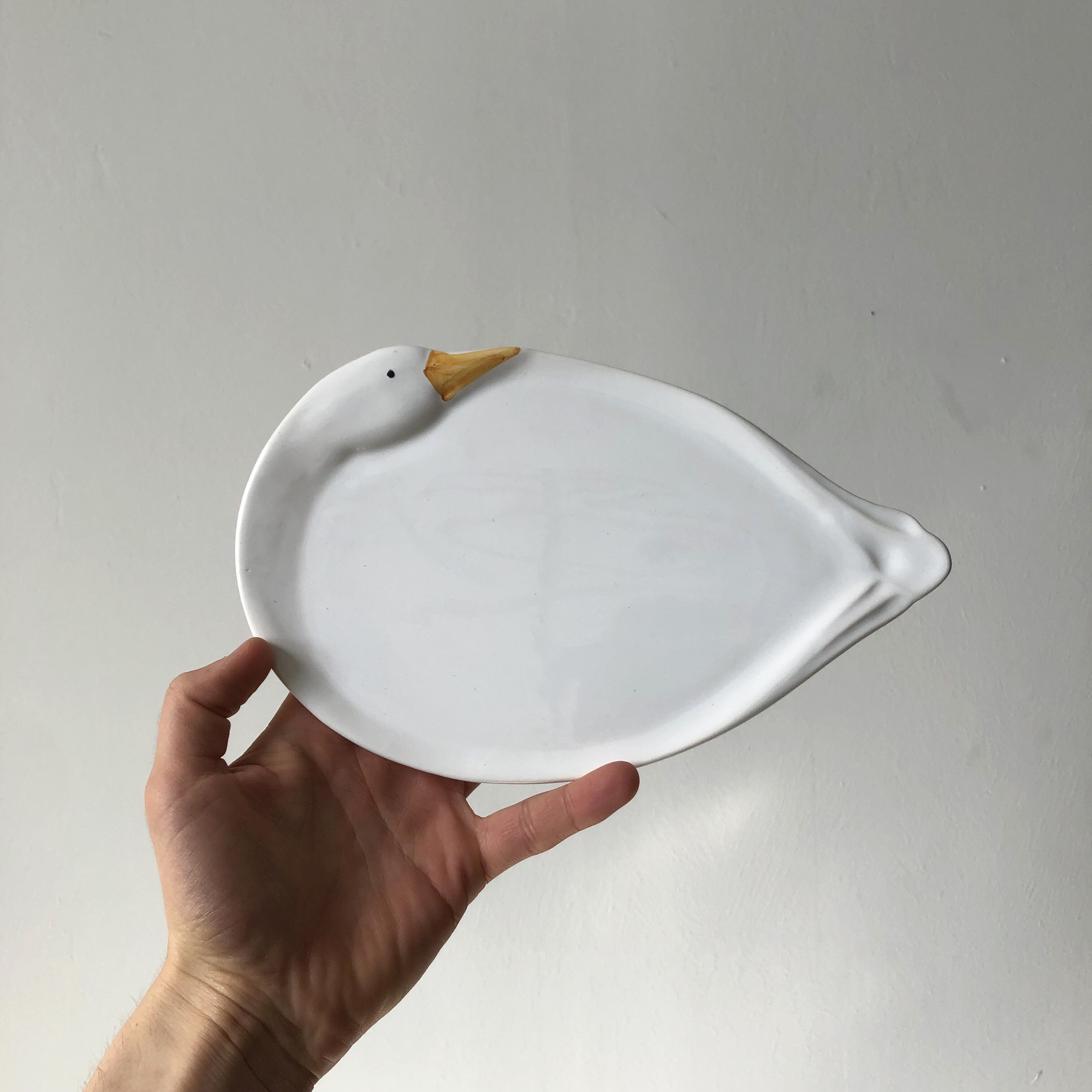 Elegant serving dish in vintage white goose ceramic. Signed DH