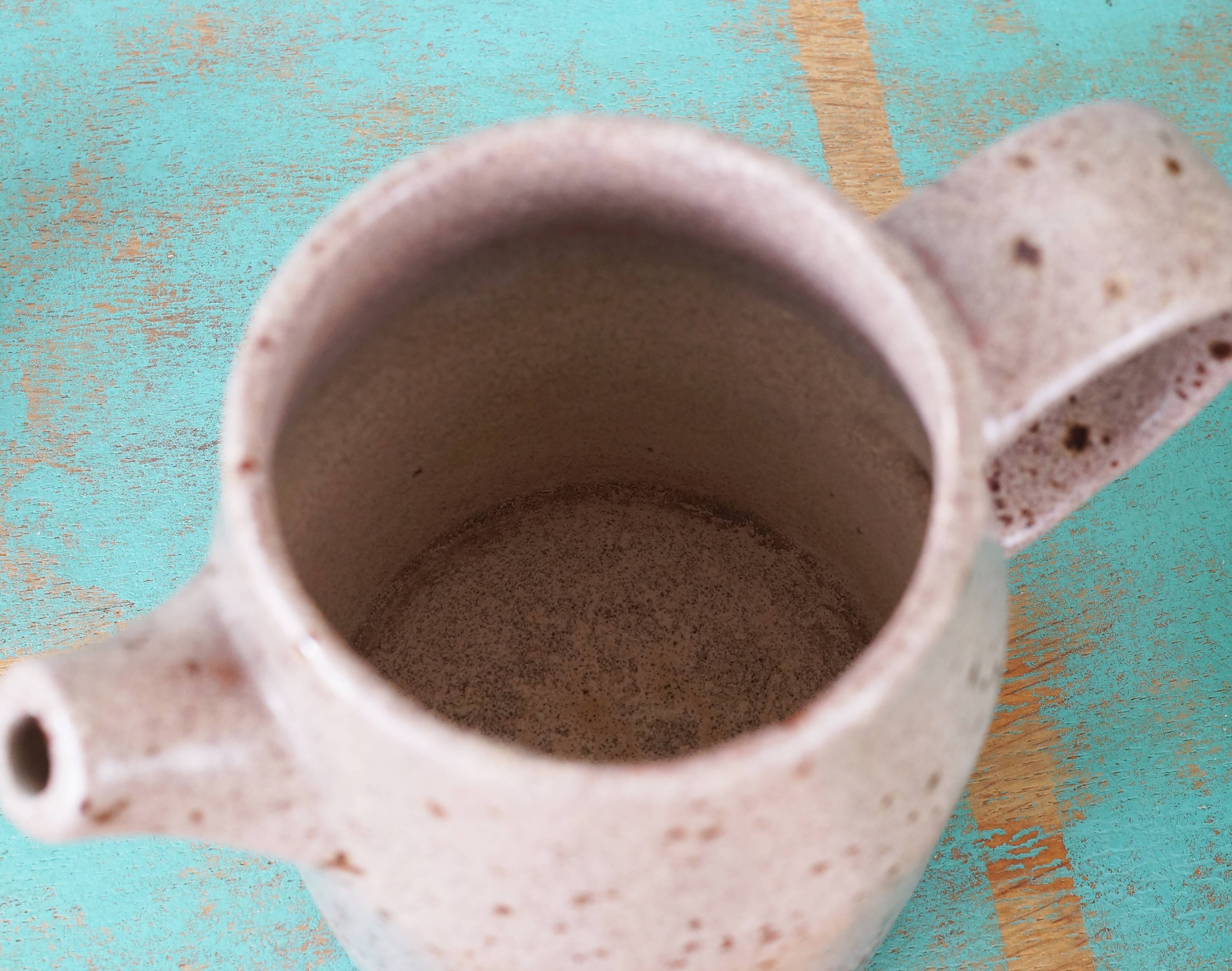 Pyrite sandstone pitcher stamped "Roman", 70s