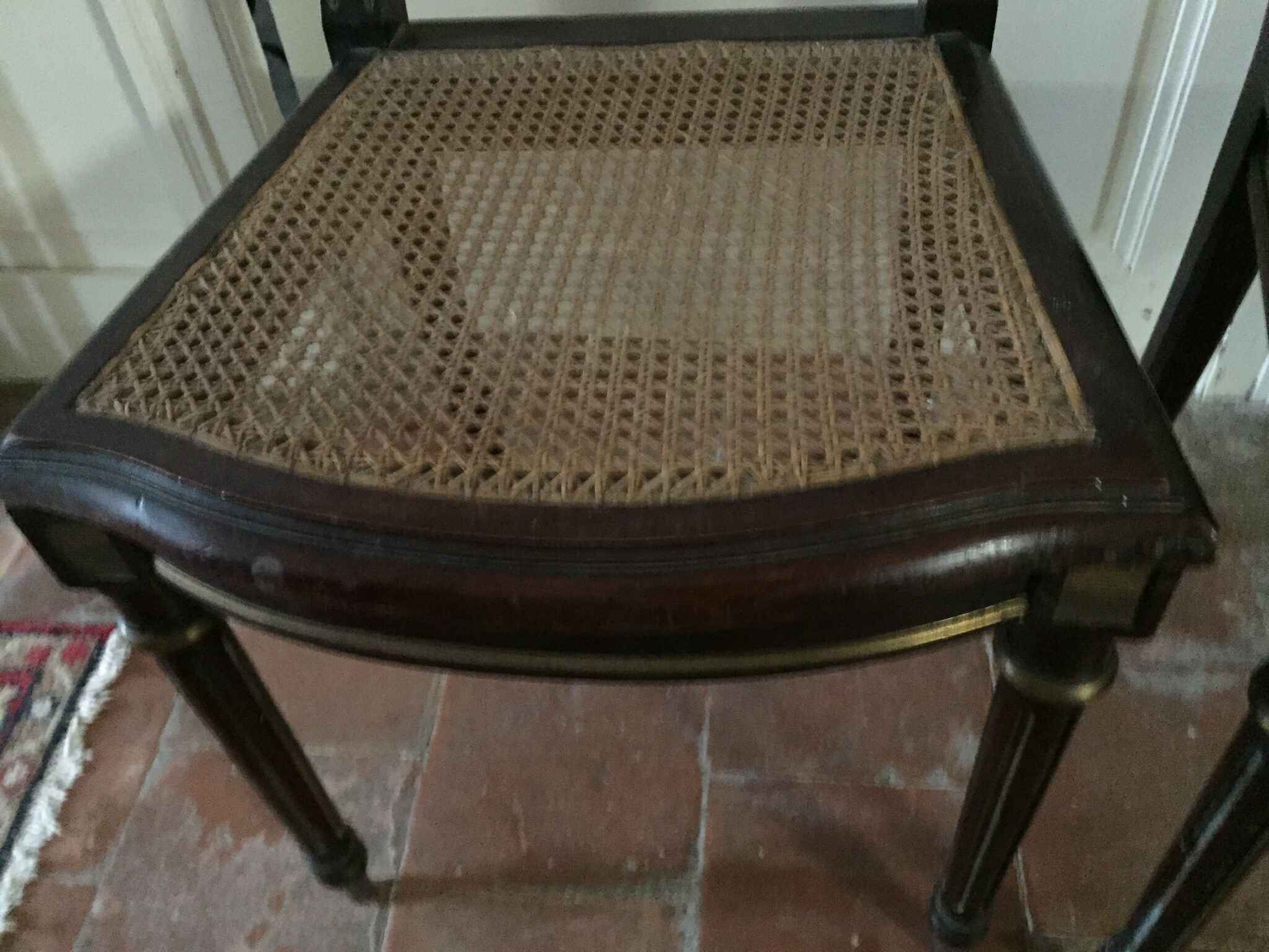 Pair of Napoleon III chairs in mahogany golden brass fillets